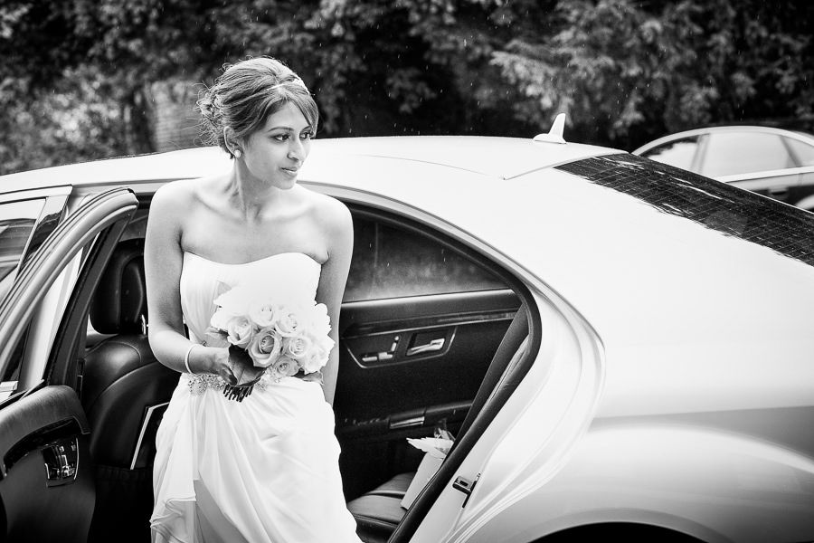 bride sindu getting out of the wedding car