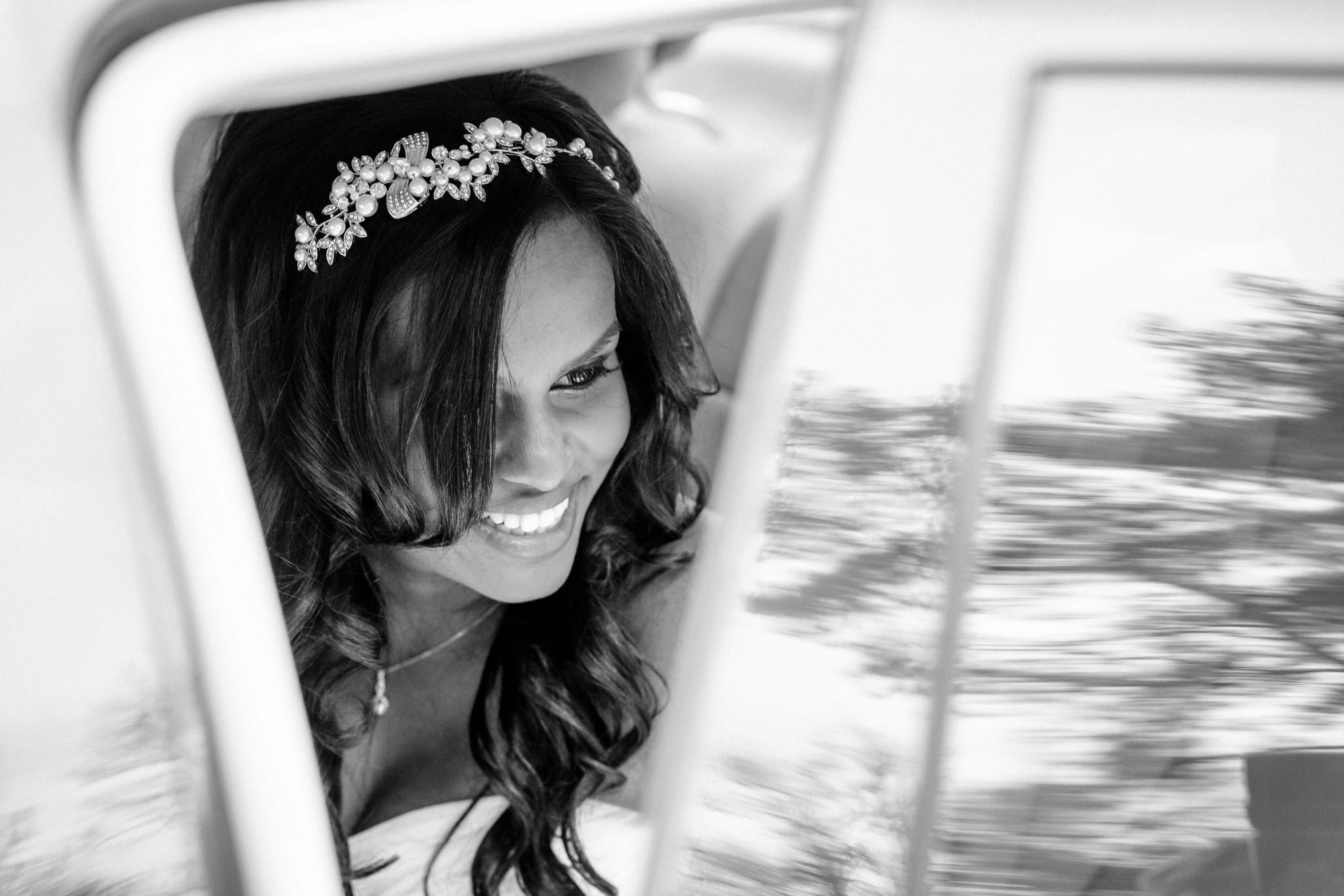 Northbrook Park Wedding Photographer bride getting off the wedding car