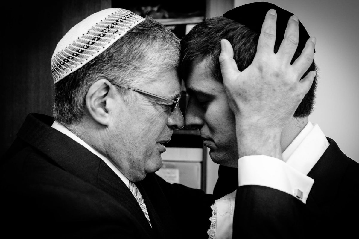 jewish blessing of the father during the wedding on the photography