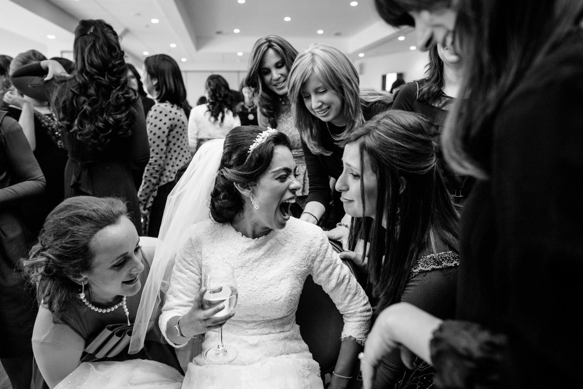 Jewish Wedding Photography bride on her wedding have fun with friends