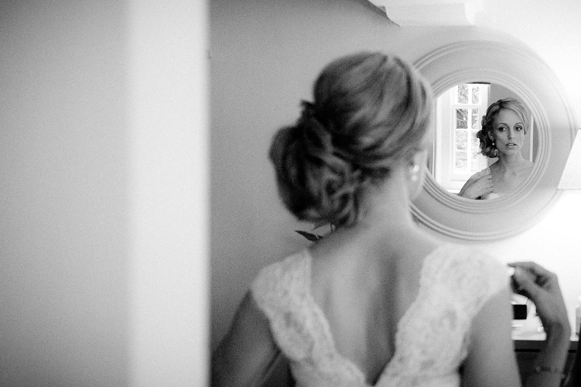 Best London Wedding Photographer bride looking into the mirror