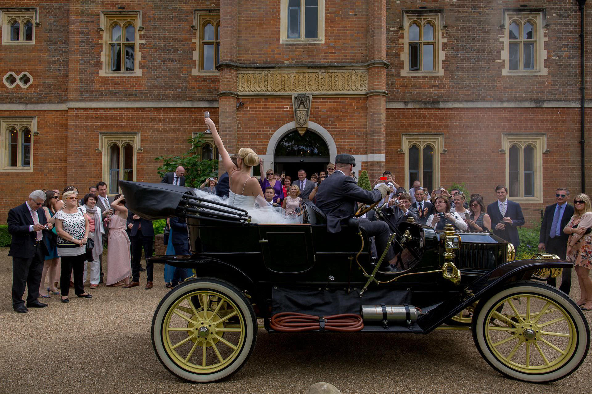 Wotton House wedding couple greeted by the guests