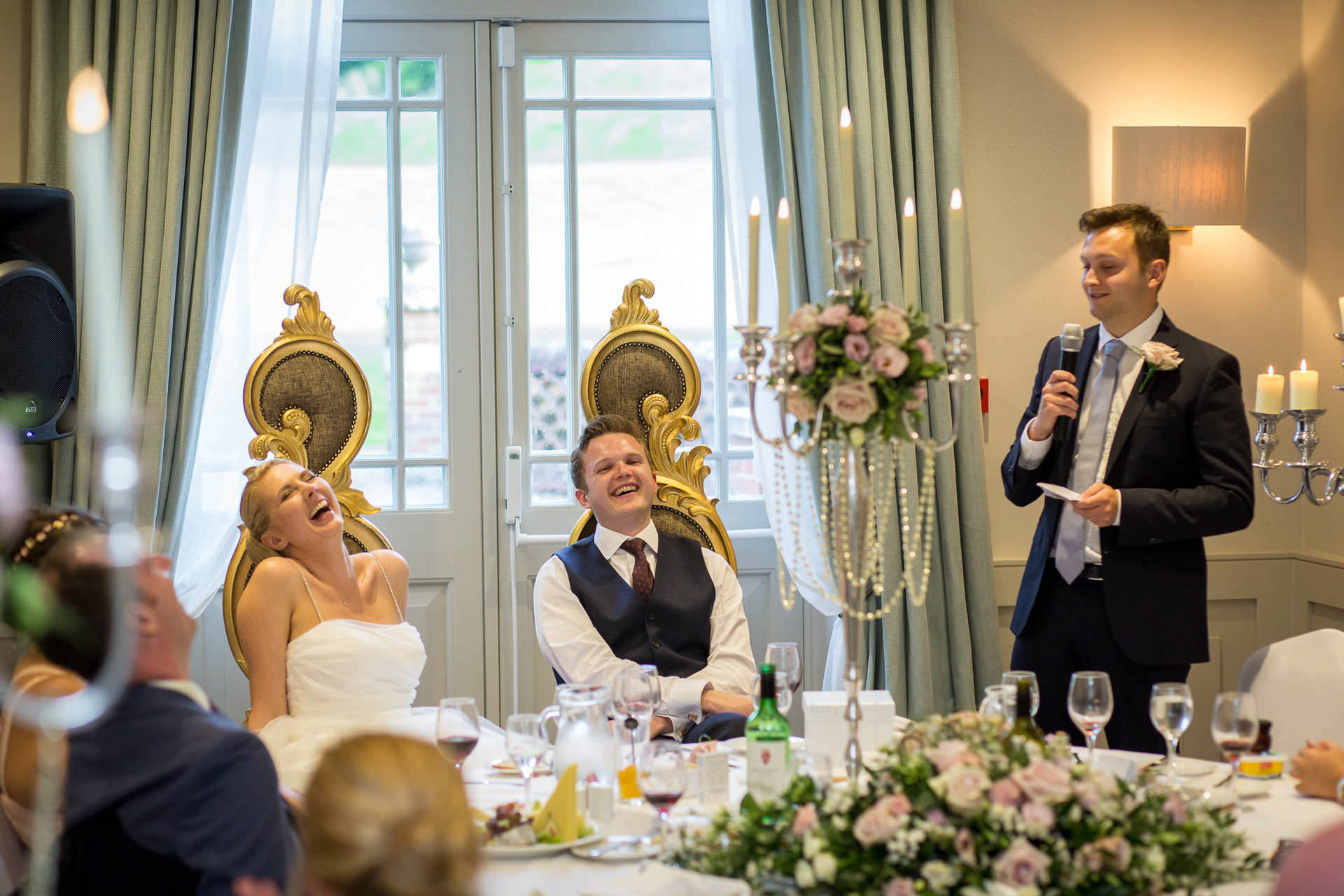 Wotton House wedding top table smiles and laughs