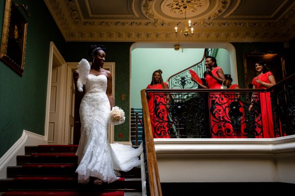 Nigerian wedding bride walking down the stairs before the ceremony