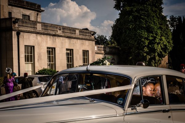 Nigerian wedding Bride and groom in the car during the couple session