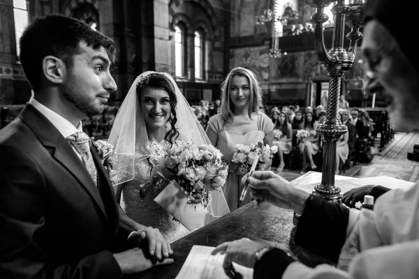 Greek Wedding Photographer signing the registrar