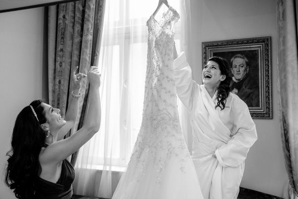 Greek Wedding Photo of bride hanging her wedding dress