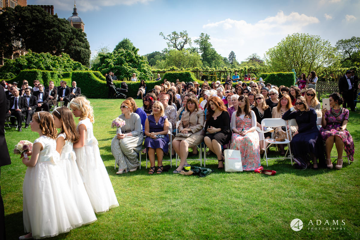 hatfield house wedding photographer guests observing the ceremony