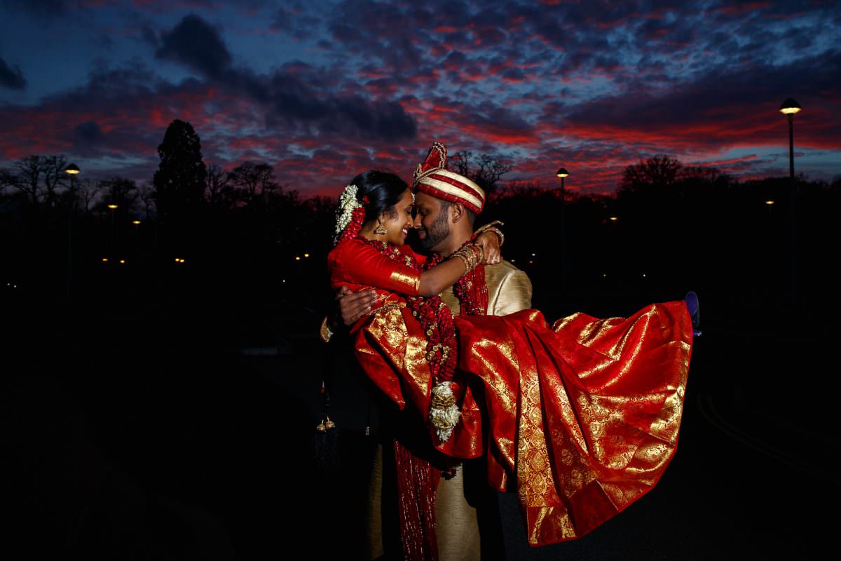 Tamil Groom Holding Bride