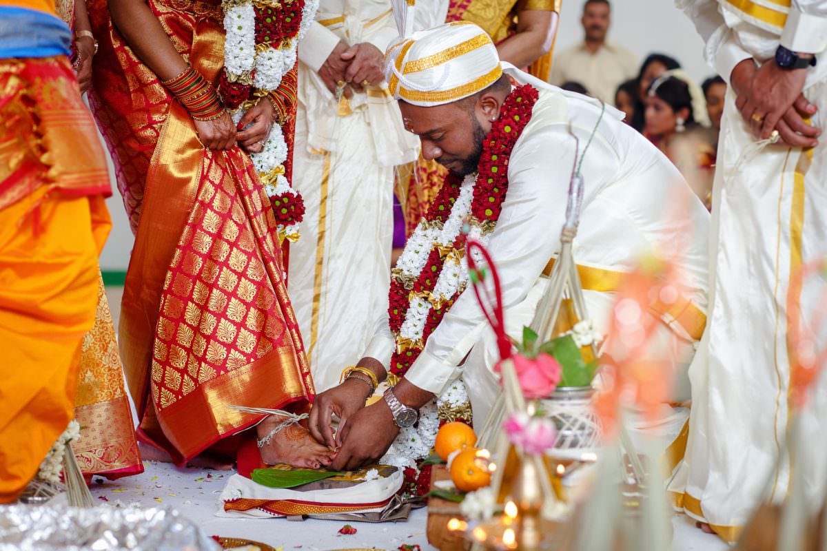 Tamil Groom Putting Ring On Bride Toe