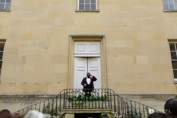 syon park house wedding groomsman is announcing the newly wed