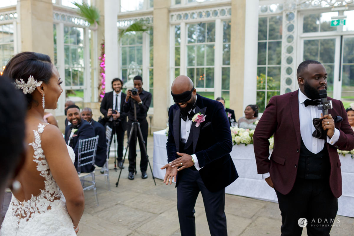 syon park house wedding groom blindfold