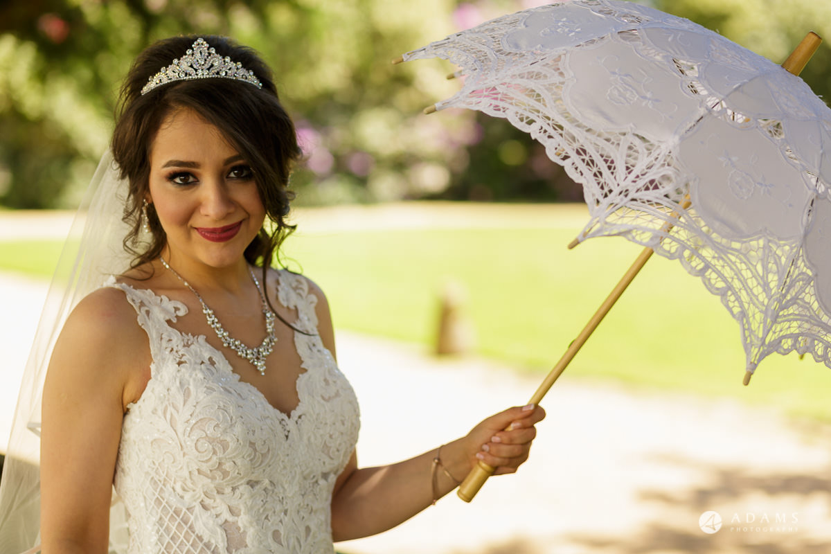 pinewood studios wedding bride posing with umbrella in her hand