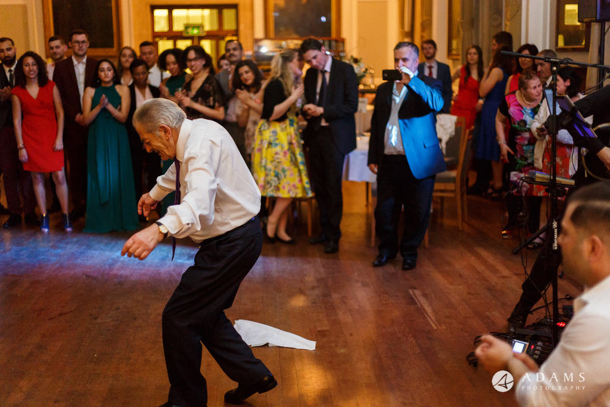 Royal Holloway wedding photographer brother of the bride and father greek dance