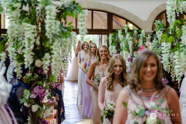 st donats castle wedding bridesmaids walking down the aisle close up