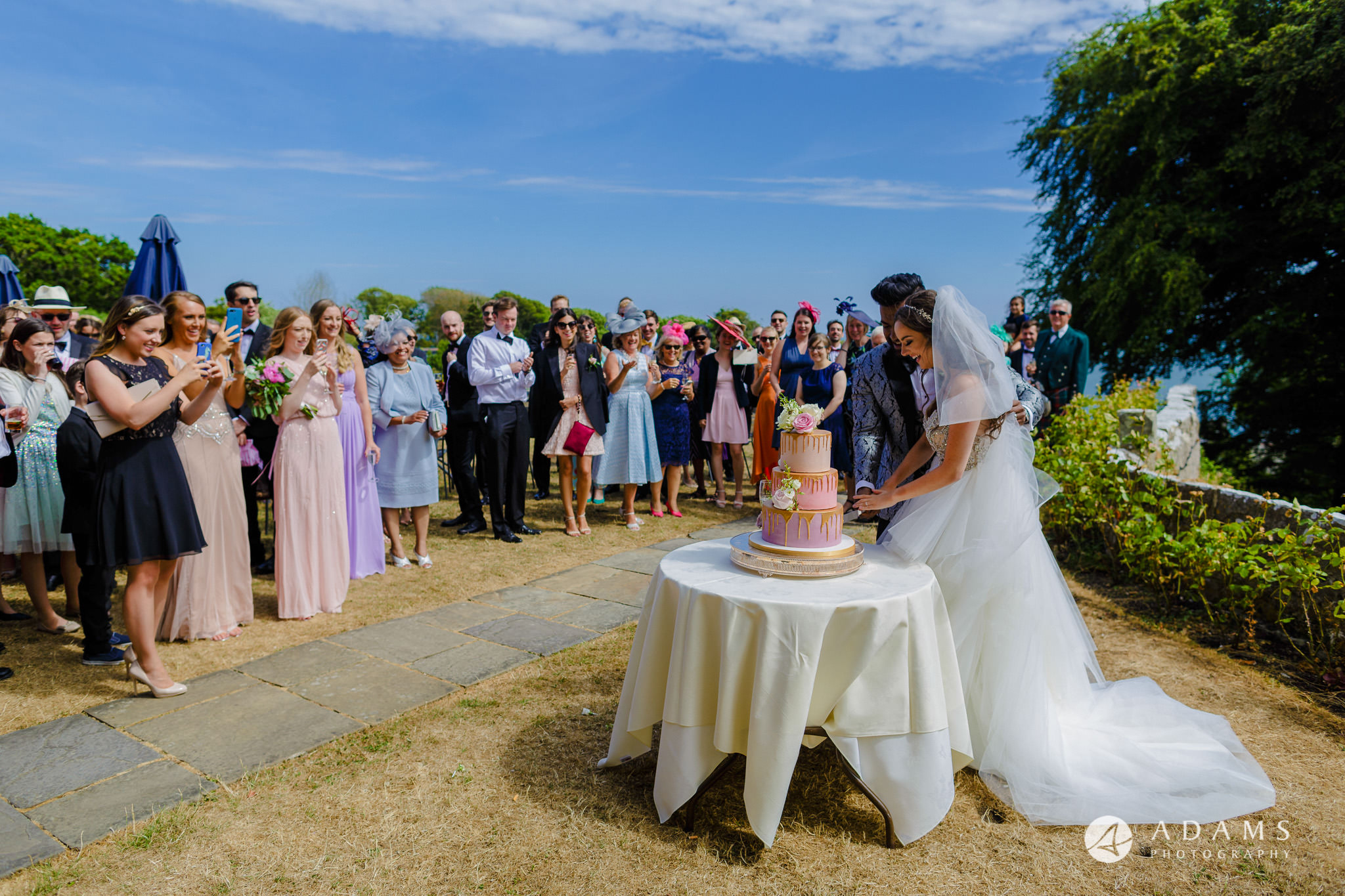 st donats castle wedding cutting the cake
