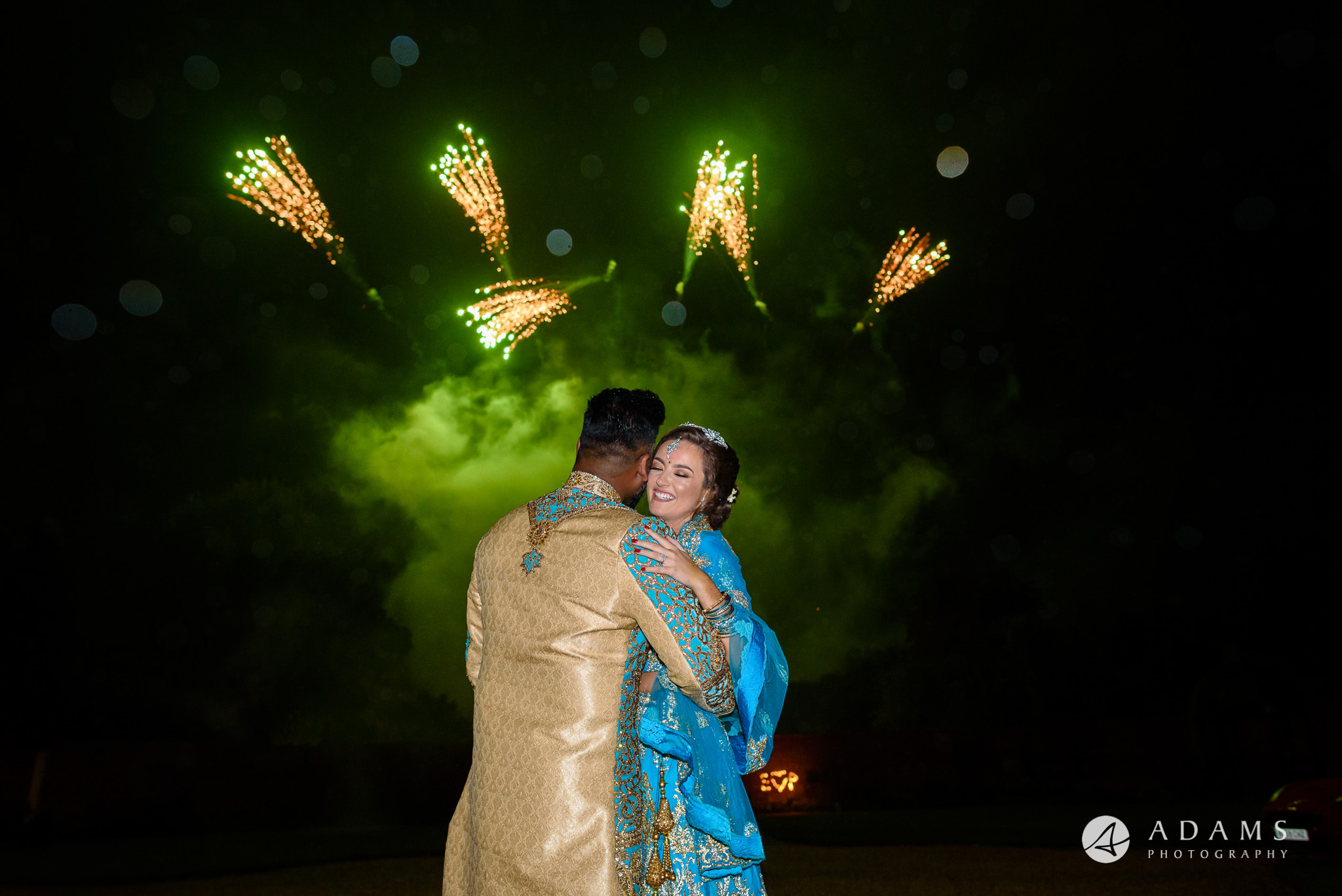 walled garden orchardleigh wedding the couple hugs in front of the fireworks