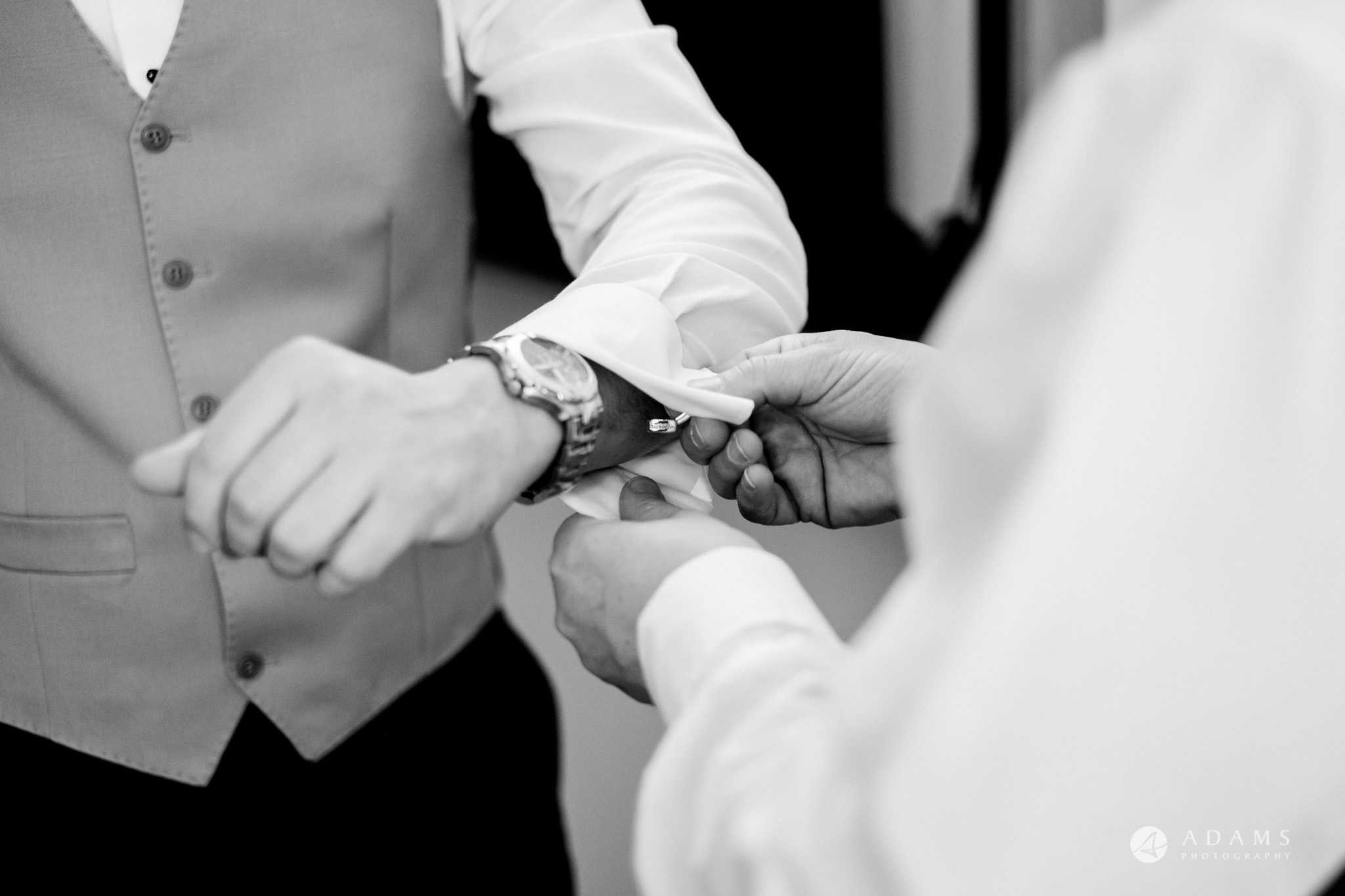 grand connaught rooms wedding groom shows his watch