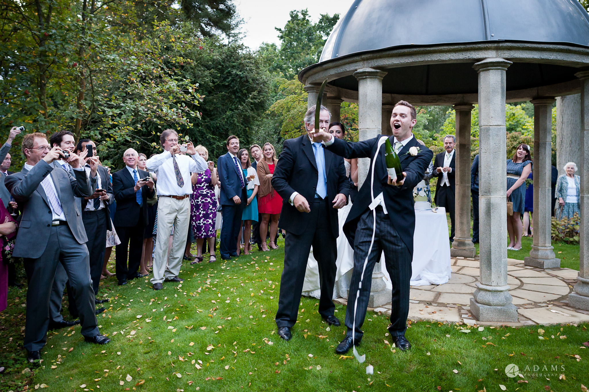 Kingston Bagpuize House wedding champage opened with a sward
