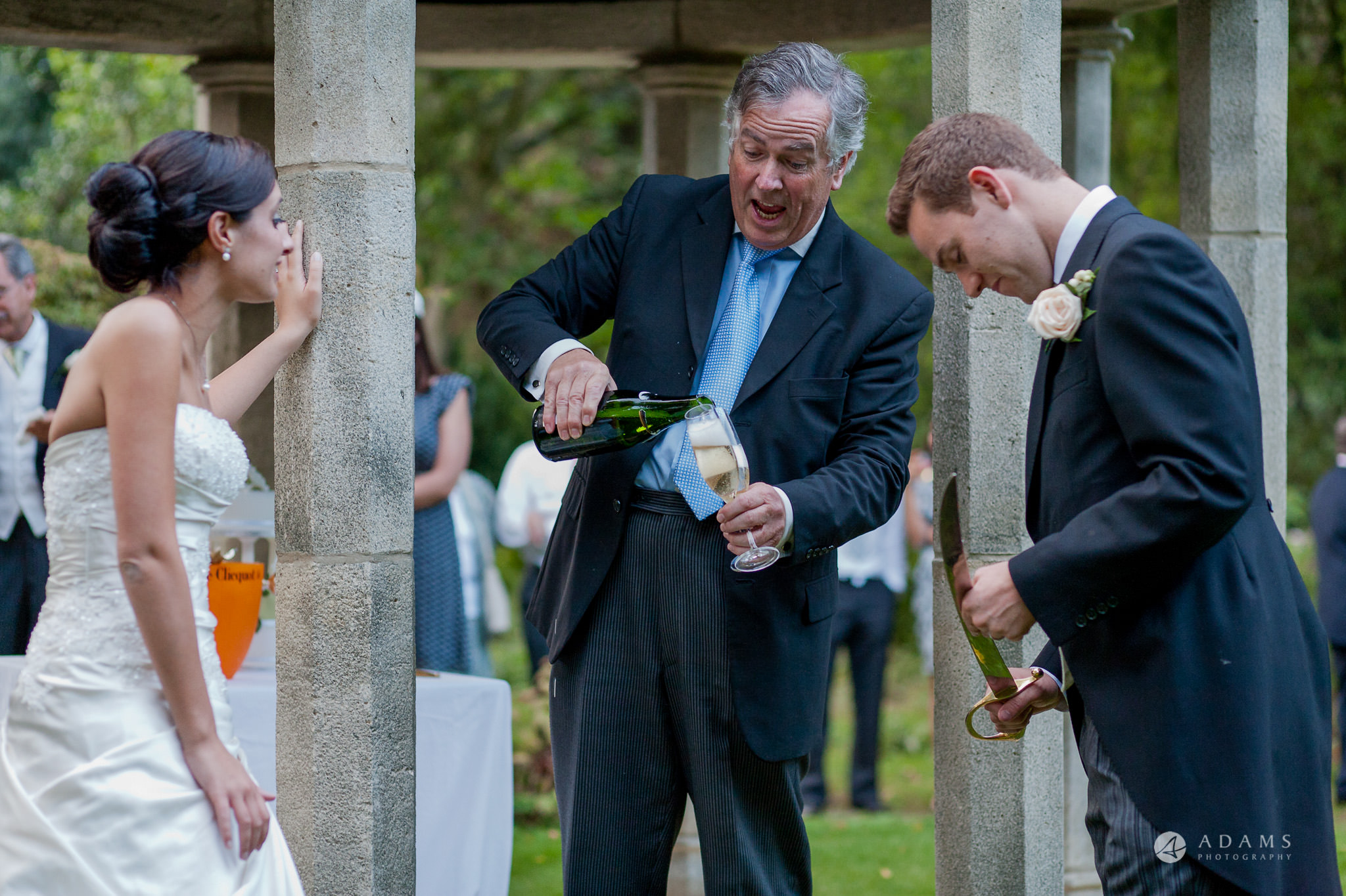 Kingston Bagpuize House wedding toast master pours champagne