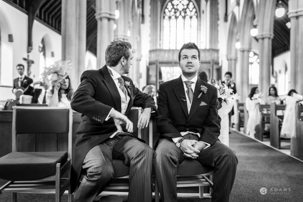 St Audries Park wedding groom siting in the church looking up