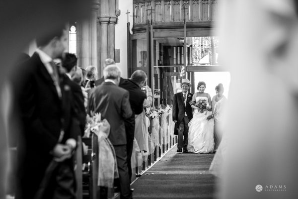St Audries Park wedding bride walks down the aisle with her father