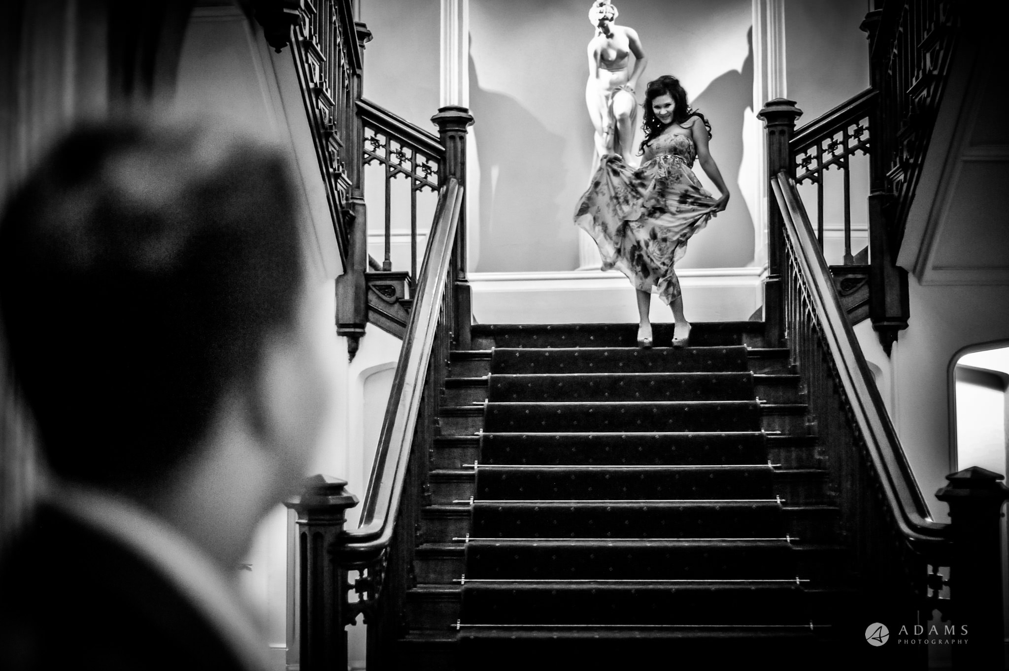Bride dancing on the stairs at St Audries Park