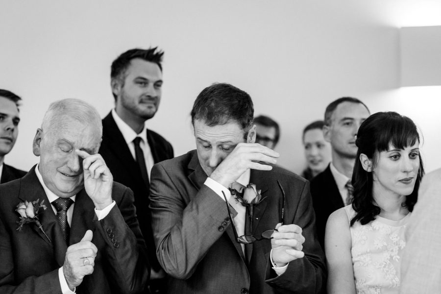 black and white wedding photographer guests crying