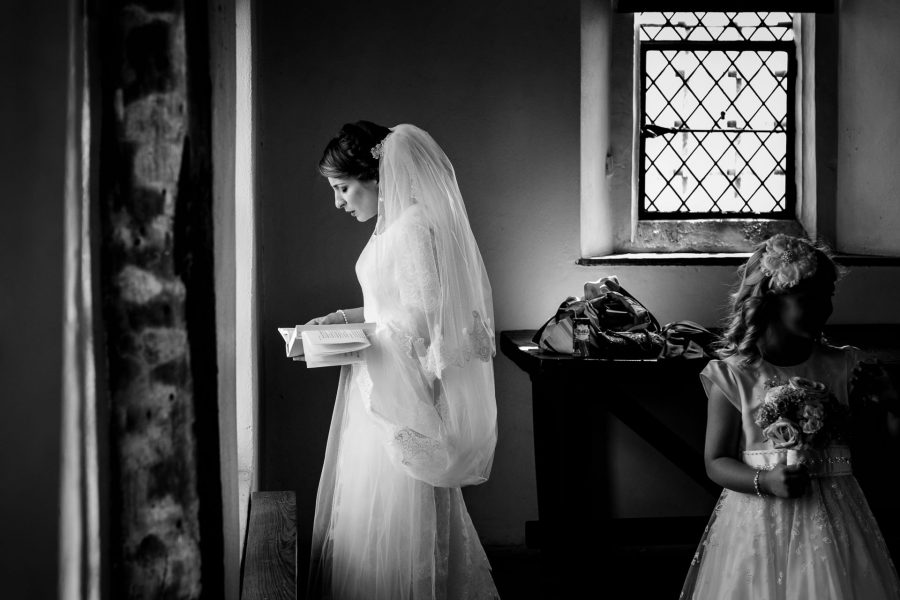black and white wedding photographer bride praying