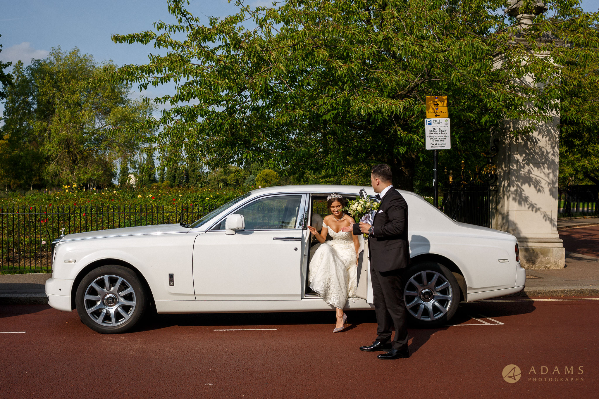Old-Marylebone Town Hall Wedding Photographer couple getting off the car