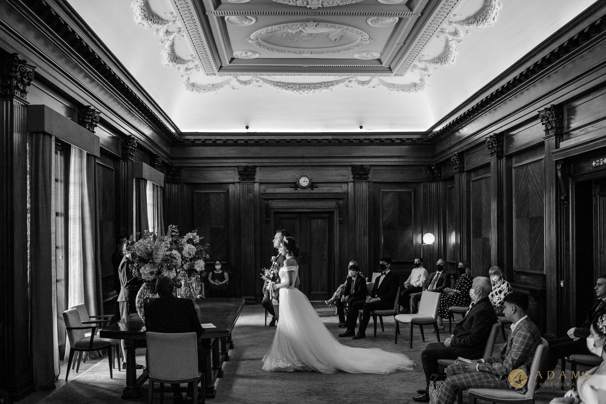 Black and white photo of the couple getting married in Westminster Room at Old Marylebone Town Hall