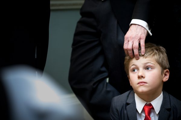 a boy pensive at the speeches