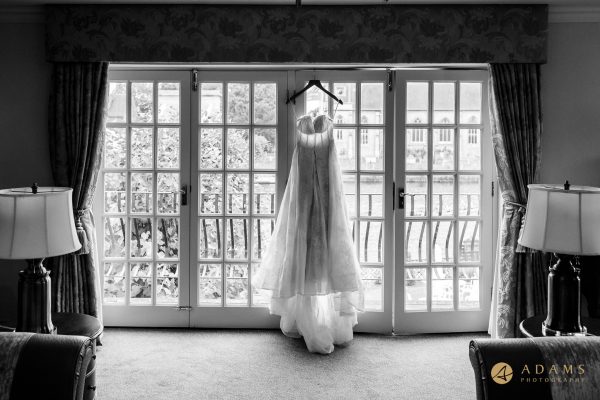 brides dress hanging on the wall in the bridal suit at McDonald Compleat Angler hotel
