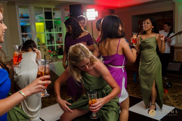 wedding guests dancing with drinks
