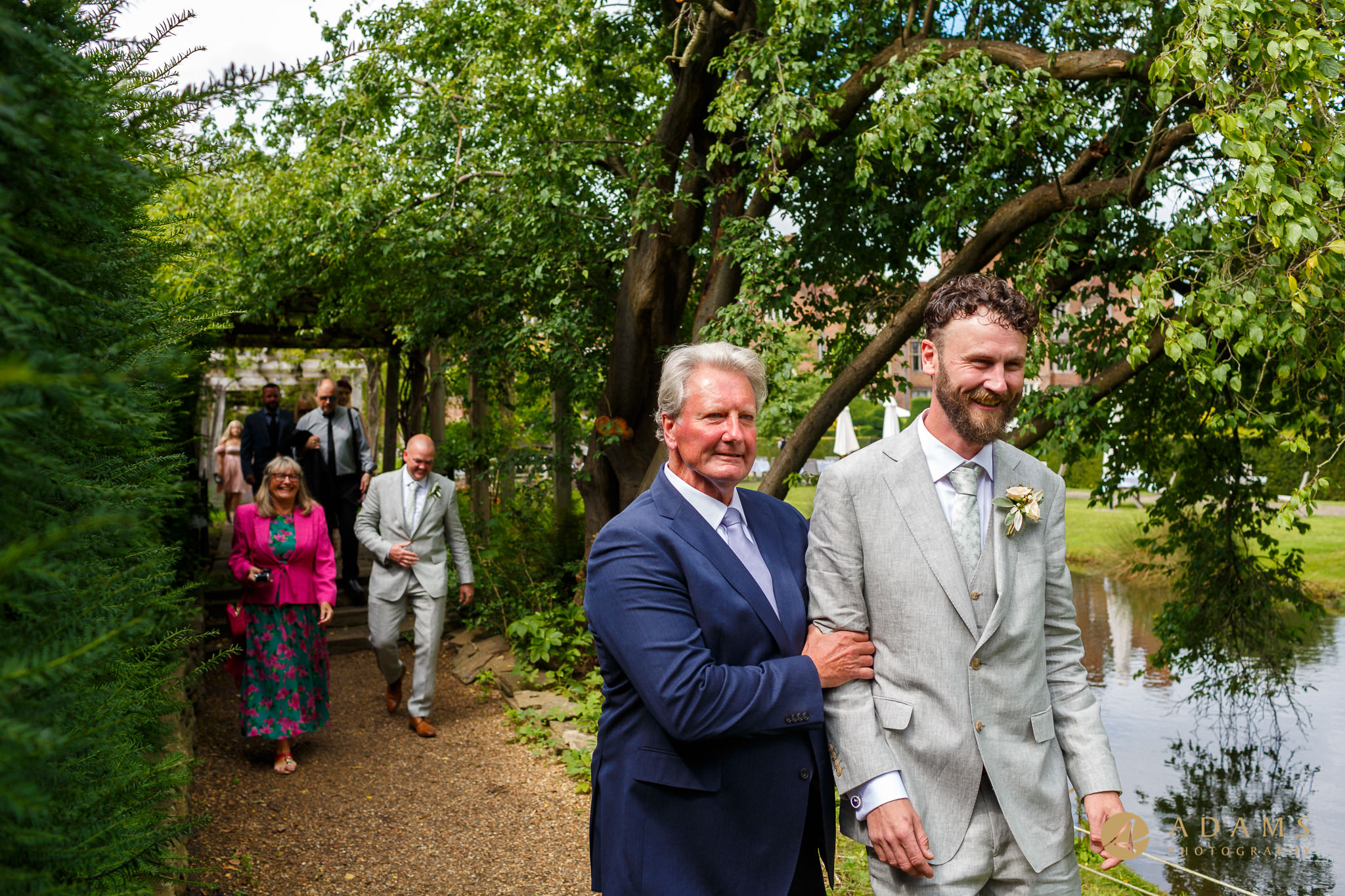 groom walks with his father