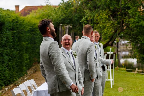 Groom and his best-man laughing