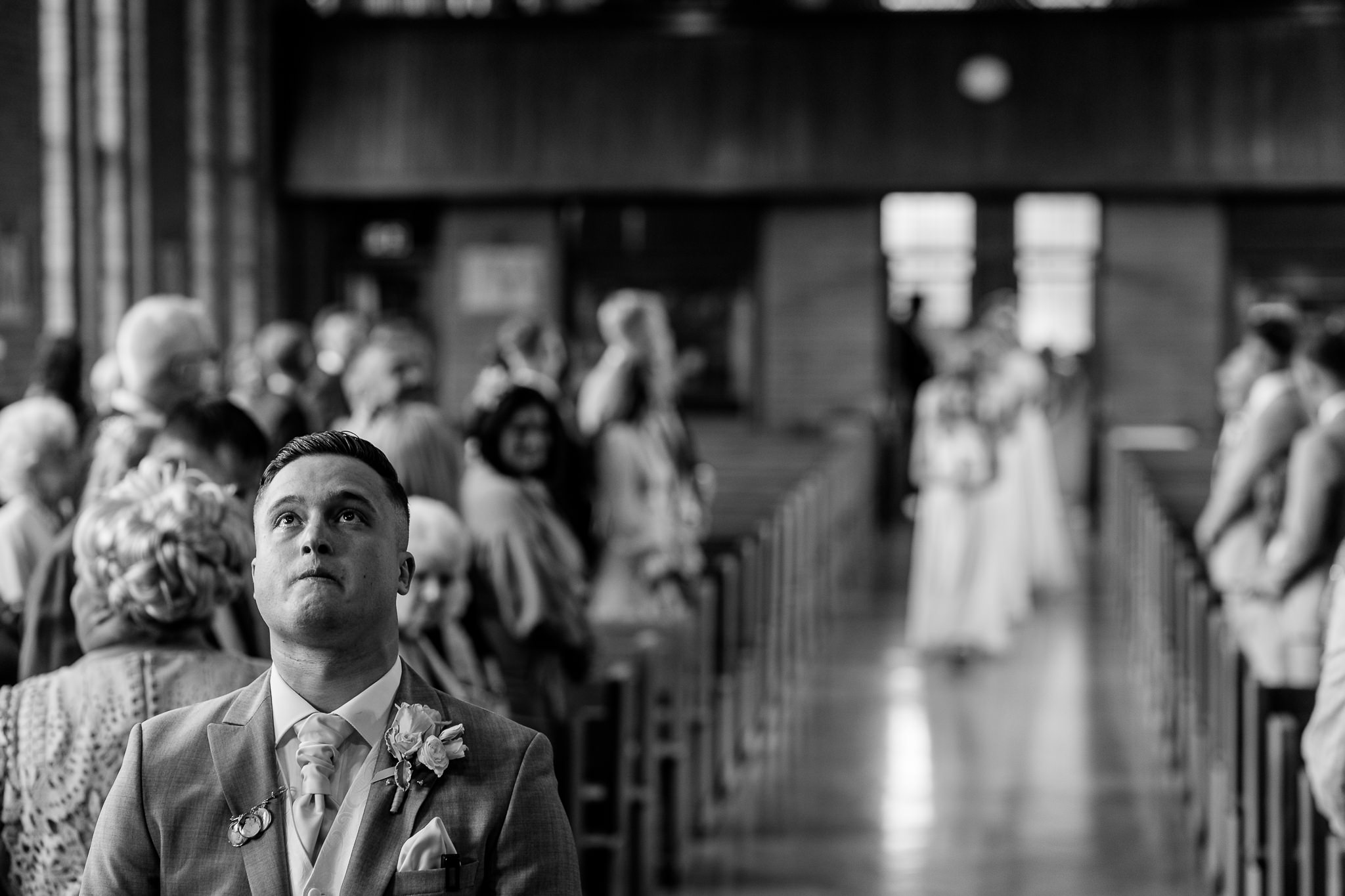 groom looking in to the sky before the bride walks down the aisle
