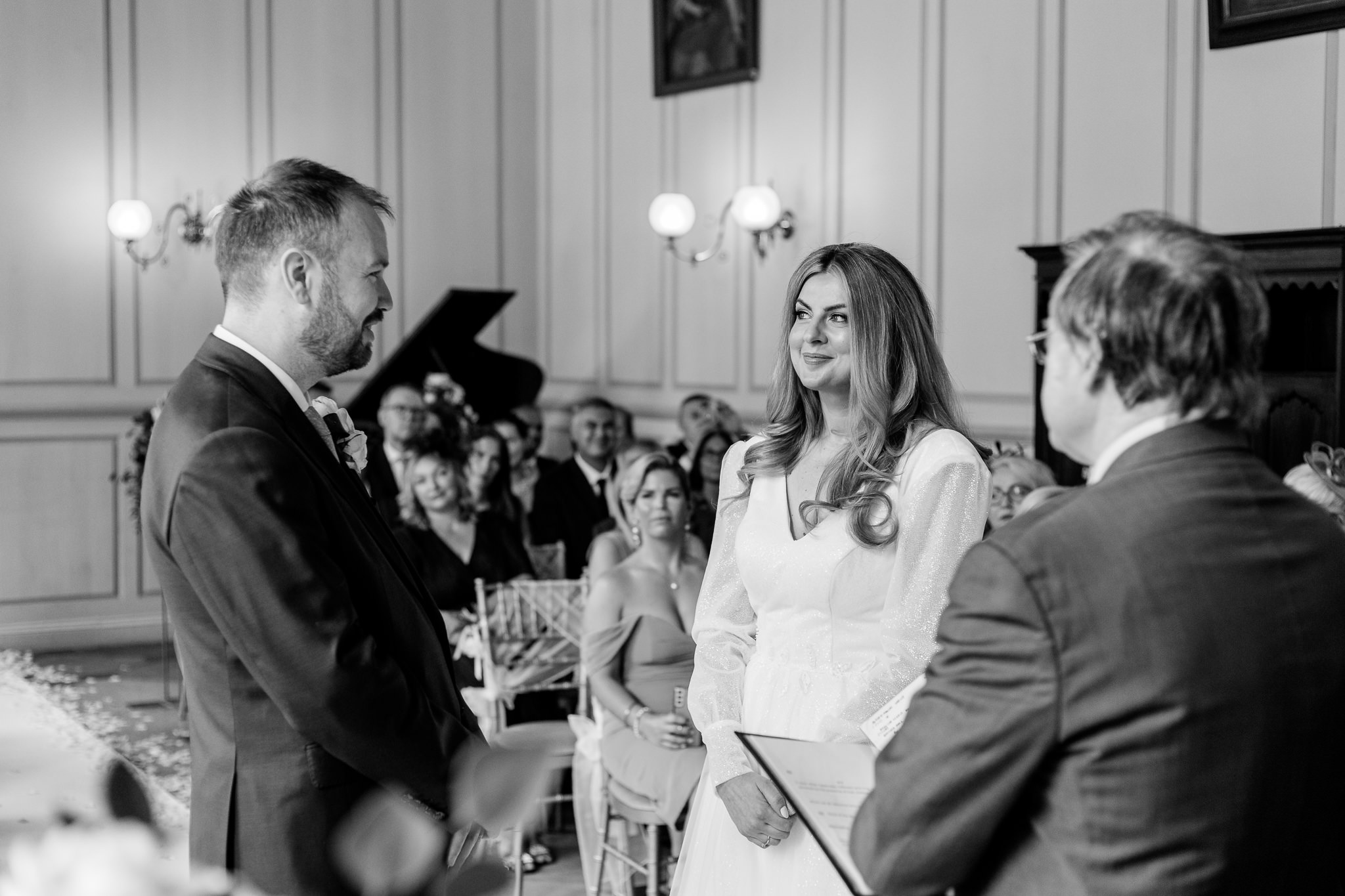 Bride and groom look at each other during their wedding ceremony