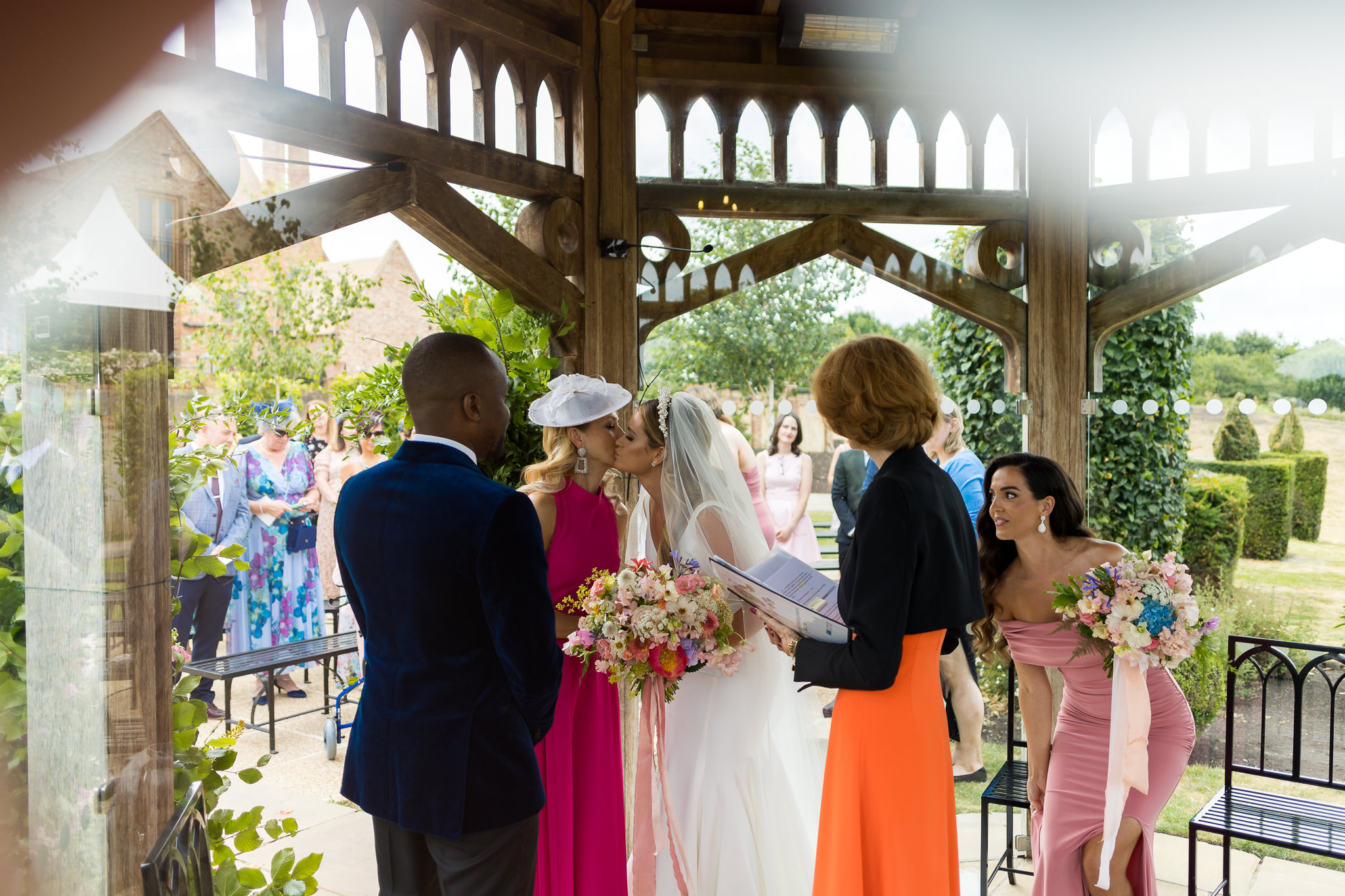 Bride and her mum kissing inside of the pavilion