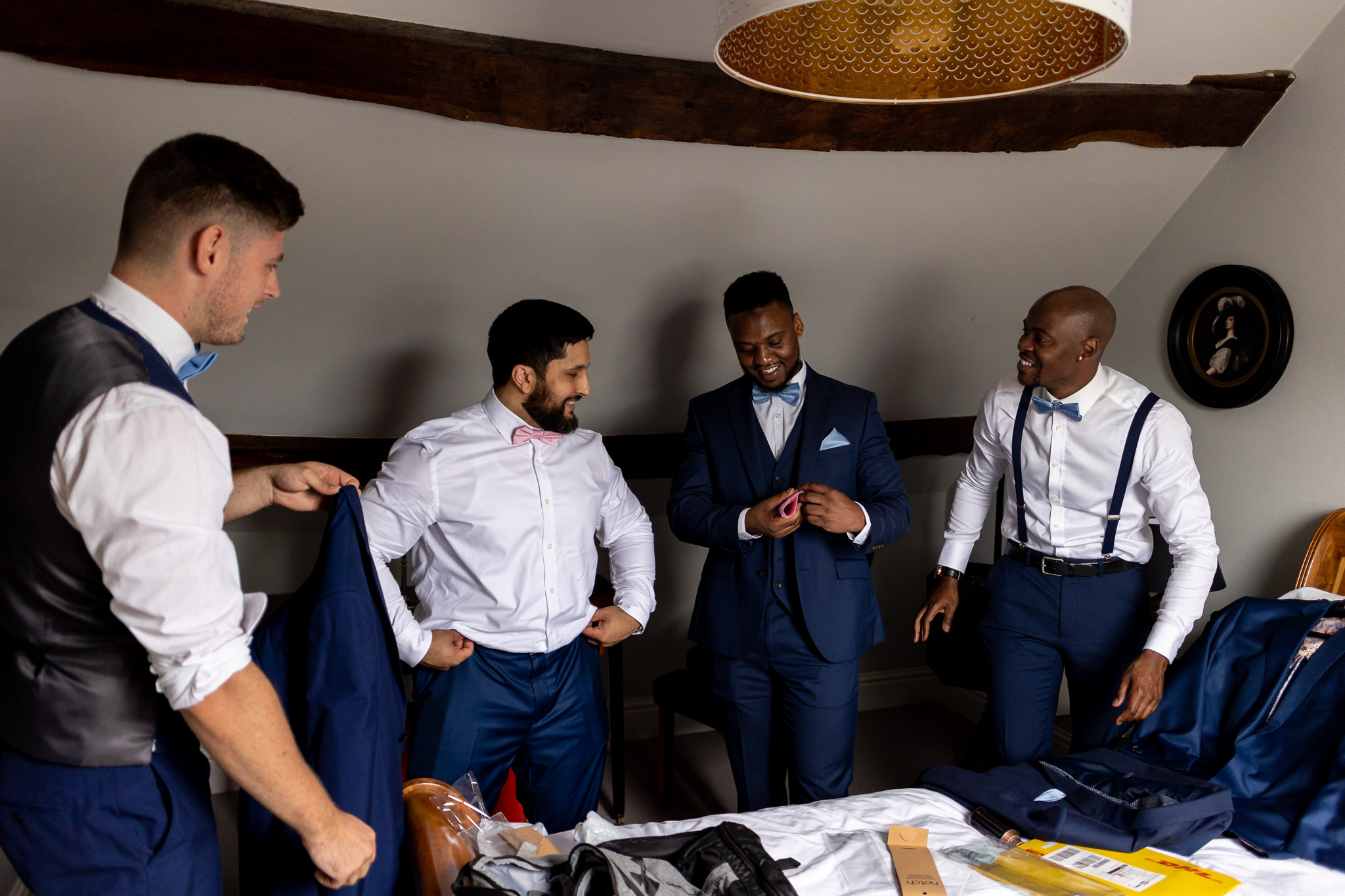 Groom and his groomsmen in the room getting ready