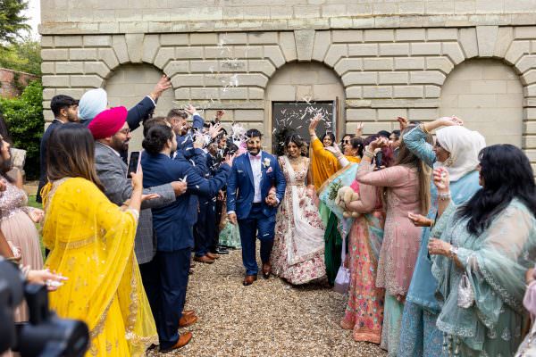 Compton Verney wedding photography Confetti shower in front of the chapel
