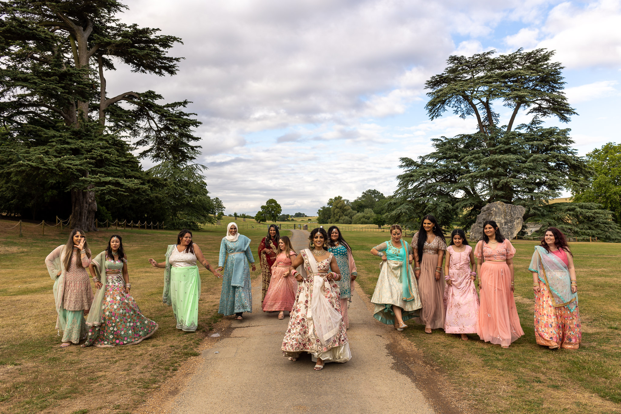 bride and bridesmaids walking inferno of the Compton Verney