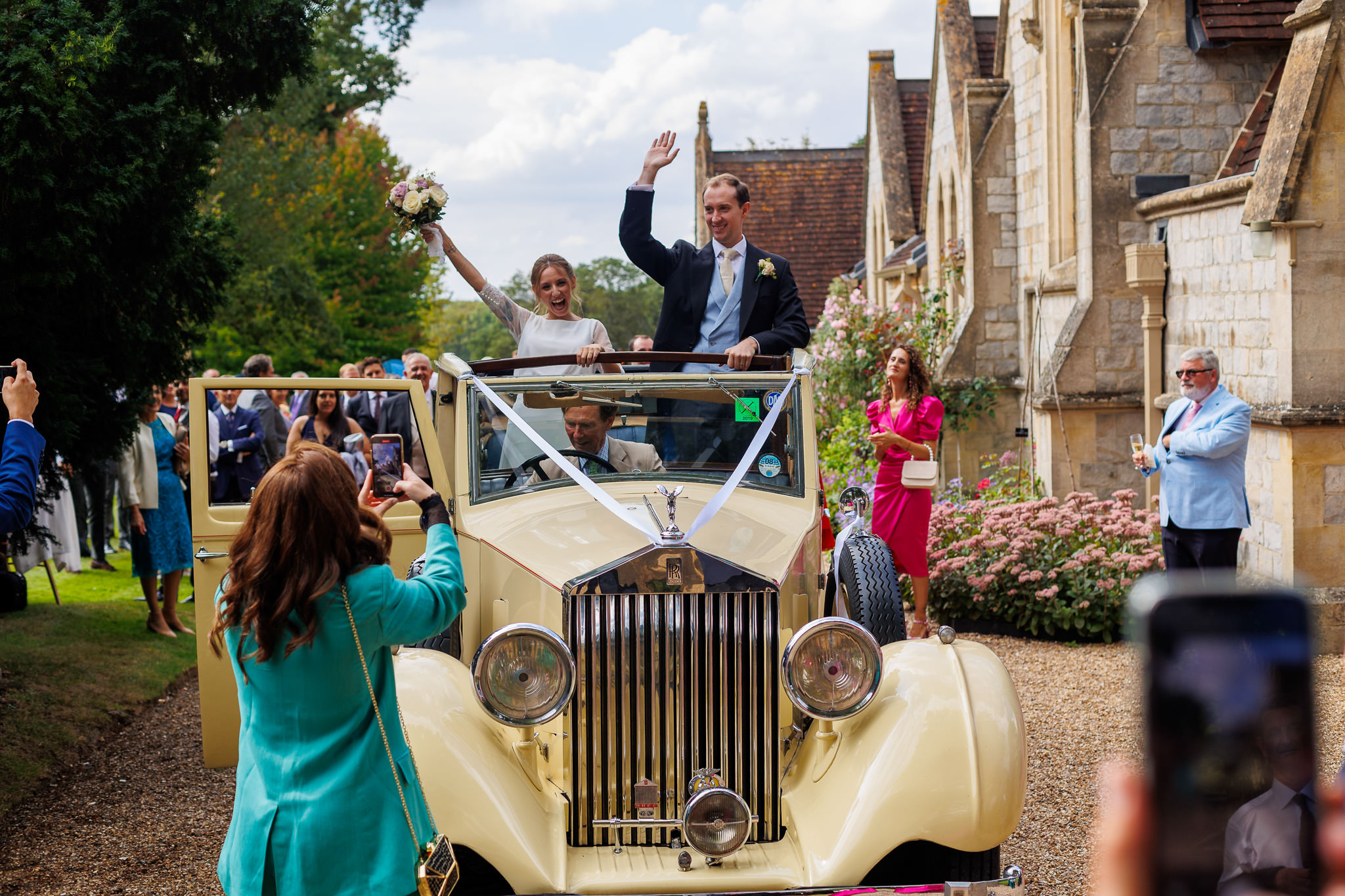 Norfolk Wedding Photographer couple leaving the church in their classic car