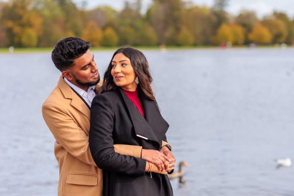 Fiance is smiling to her boyfriend over the shoulder