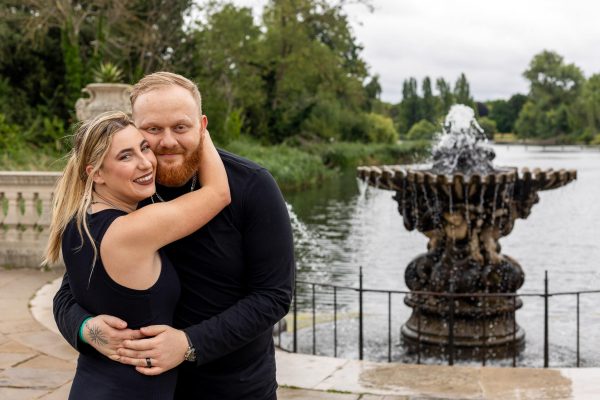 Boyfriend and his girlfriend are hugging after the proposal at Italian Gardens in London