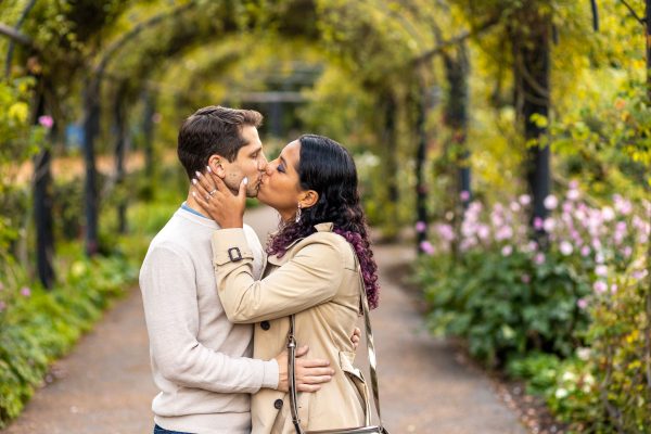 Couple kissing in Rose garden